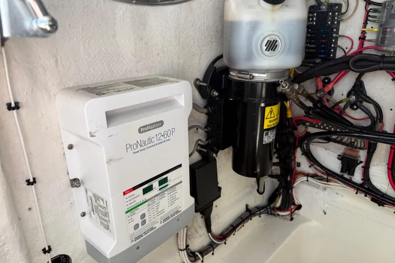 Slide: The Image of Electrical system components in a 2001 Palmetto Custom 36 boat, featuring ProNautic charger. - 31