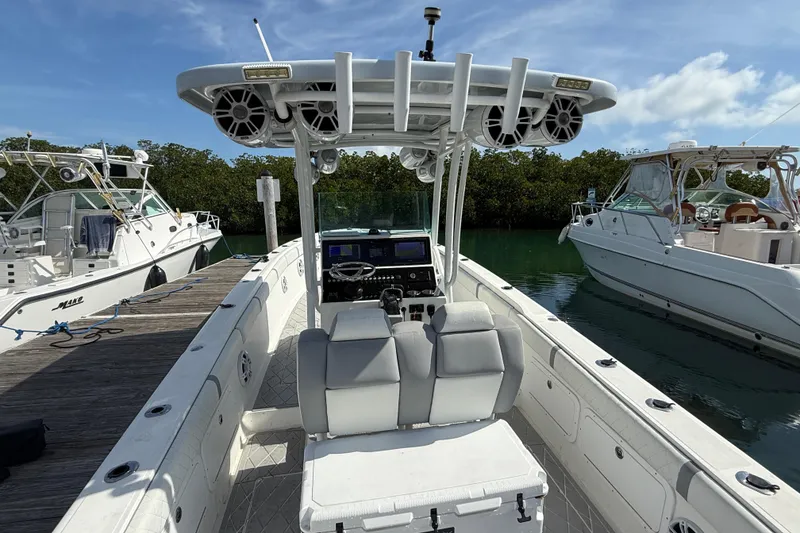 Slide: The Image of 2001 Palmetto Custom 36 boat docked, featuring dual seats and advanced navigation equipment. - 32