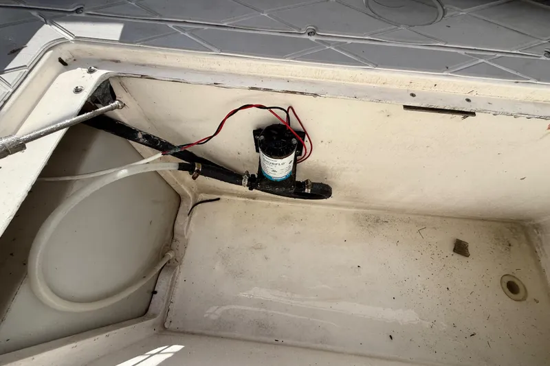 Slide: The Image of Bilge area of 2001 Palmetto Custom 36 boat with pump and wiring visible. - 33