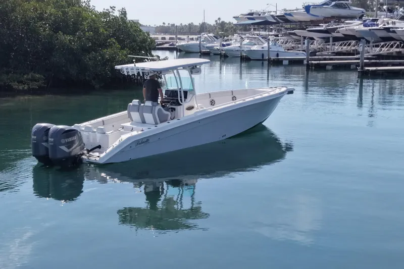 Slide: The Image of 2001 Palmetto Custom 36 boat with dual Yamaha engines on calm water. - 5