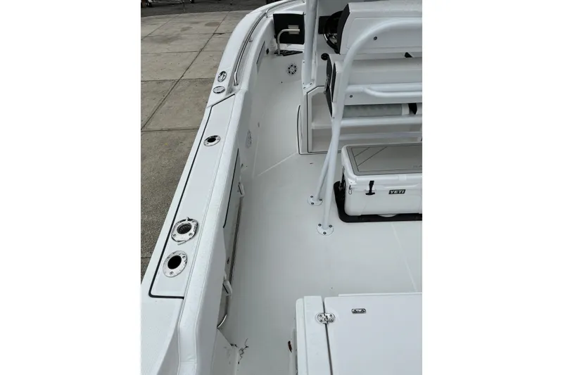 Slide: The Image of 2026 Blackfin 222 CC boat interior with seating and storage compartments. - 11