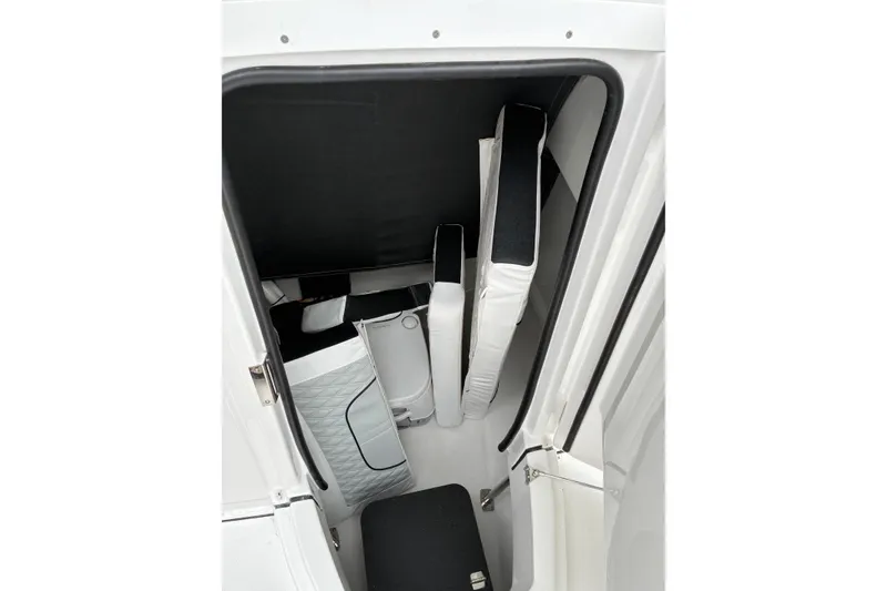 Slide: The Image of Interior view of 2026 Blackfin 222 CC boat storage compartment. - 17