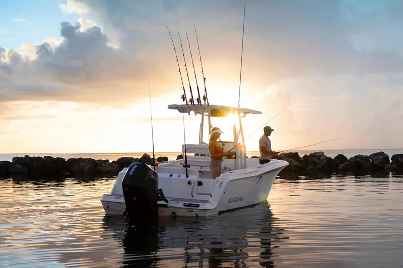 Slide: The Image of Manufacturer Provided Image: 2026 Blackfin 222 CC boat at sunset with two people fishing. - 19