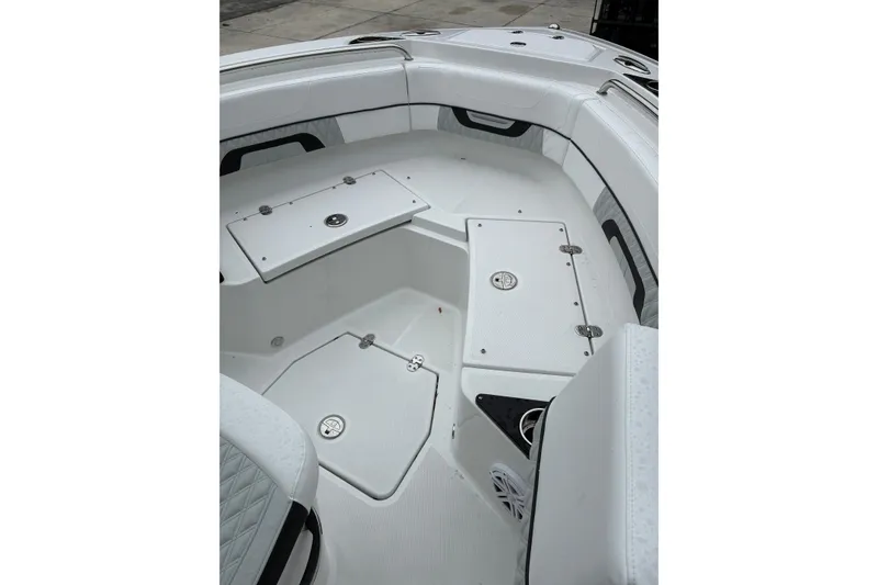 Slide: The Image of 2026 Blackfin 222 CC boat interior with storage compartments and seating. - 21