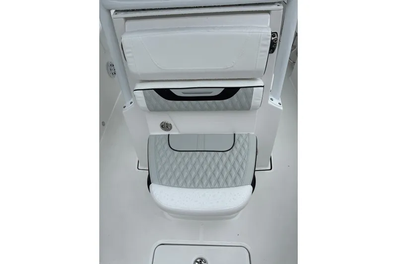 Slide: The Image of 2026 Blackfin 222 CC boat interior with cushioned seating and storage compartments. - 23