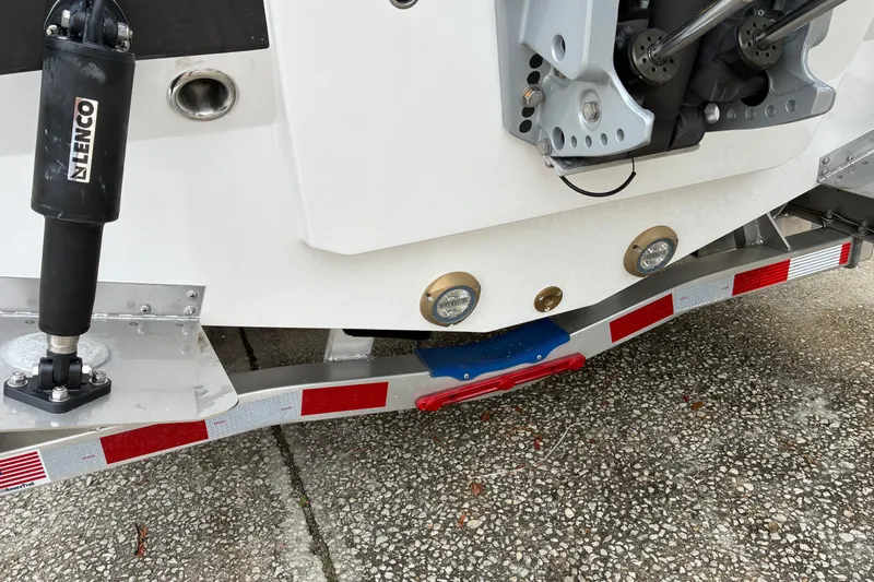 Slide: The Image of Rear view of 2026 Blackfin 222 CC boat on trailer, showing trim tabs and hydraulic system. - 6