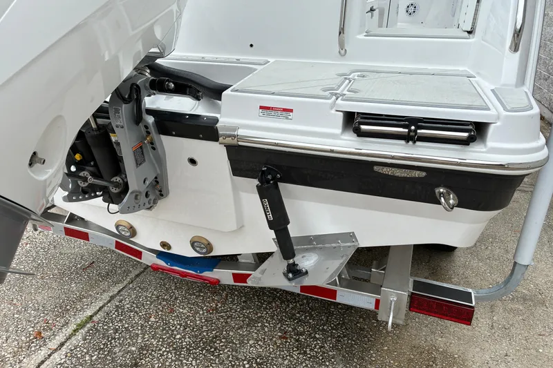 Slide: The Image of 2026 Blackfin 222 CC boat stern with motor mount and trailer detail. - 7