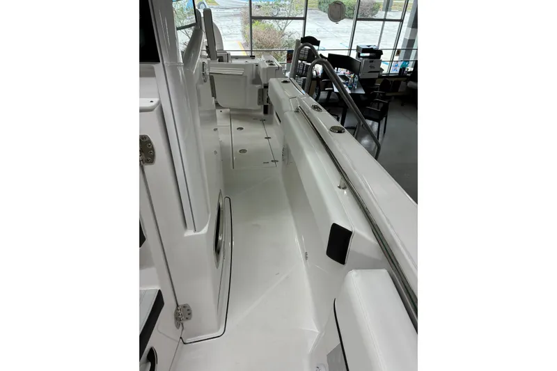 Slide: The Image of 2026 Blackfin 252 CC boat interior with sleek white design and modern features. - 15
