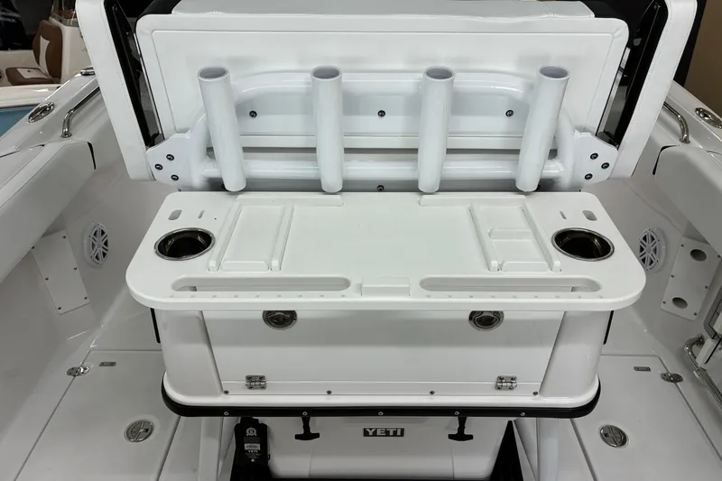 Slide: The Image of 2026 Blackfin 252 CC boat interior with rod holders and storage compartments. - 23