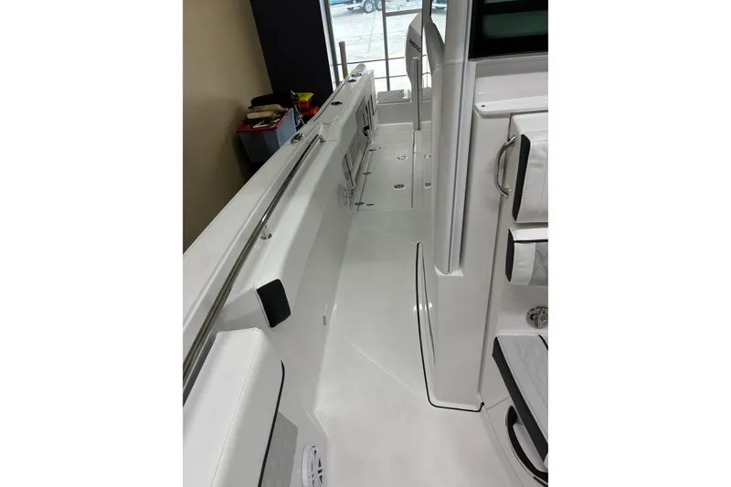 Slide: The Image of 2026 Blackfin 252 CC boat interior with sleek white deck and modern fittings. - 25