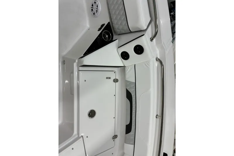 Slide: The Image of Interior view of 2026 Blackfin 252 CC boat, featuring sleek white design and storage compartment. - 26