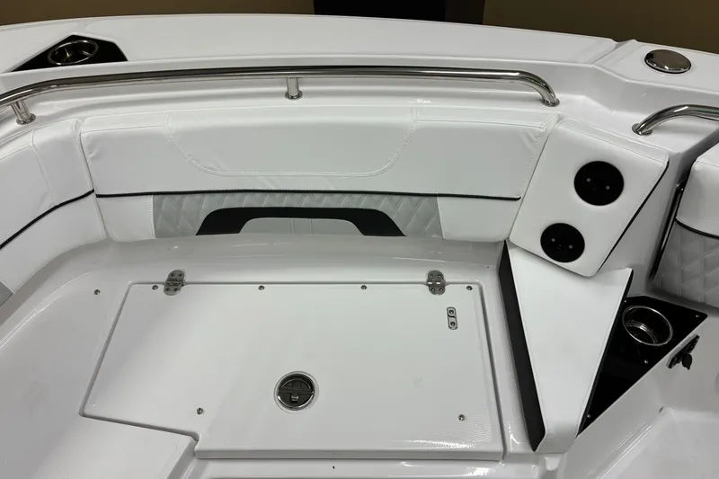Slide: The Image of Interior of 2026 Blackfin 252 CC boat, featuring white seating and stainless steel accents. - 28