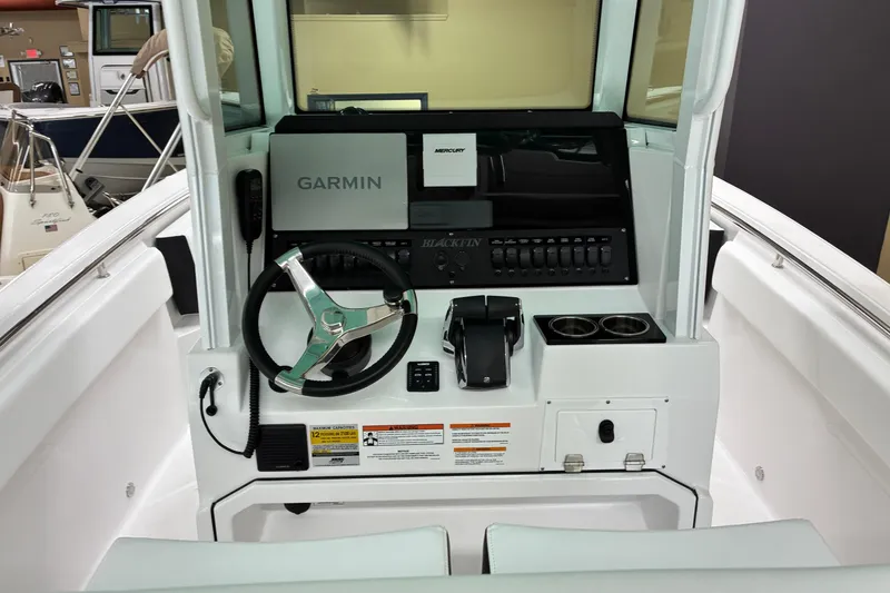 Slide: The Image of 2026 Blackfin 252 CC boat console with Garmin navigation and steering wheel. - 3