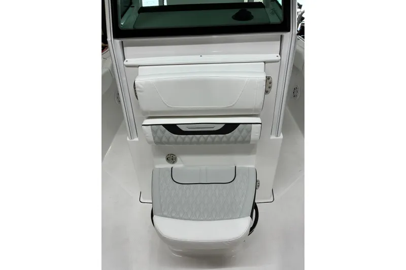 Slide: The Image of 2026 Blackfin 252 CC boat interior with white cushioned seating and storage compartments. - 30