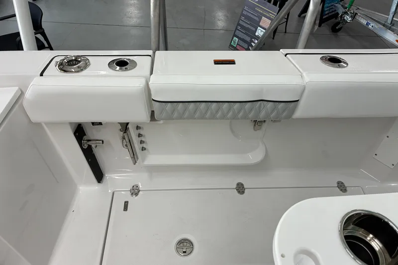Slide: The Image of 2026 Blackfin 252 CC boat interior with white seating and stainless steel fixtures. - 33