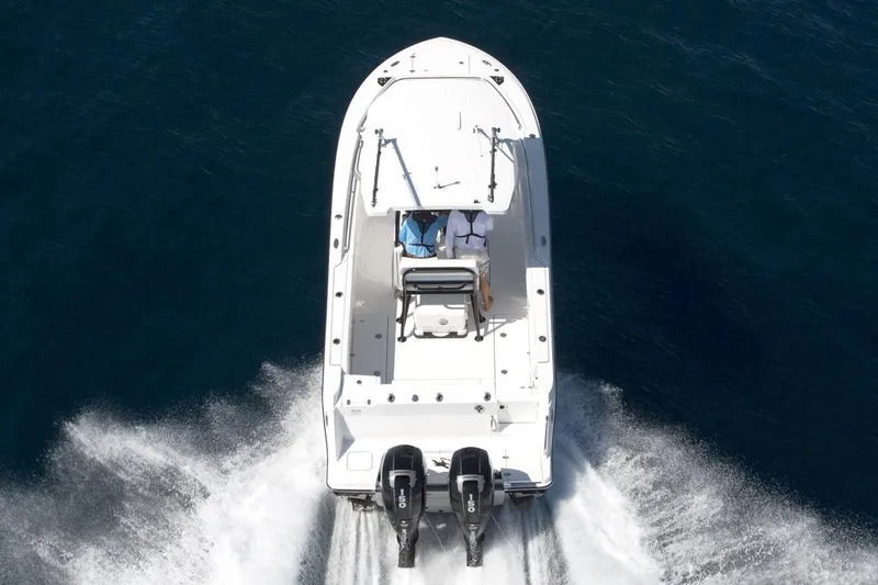Slide: The Image of Manufacturer Provided Image: 2026 Blackfin 252 CC boat cruising on open water, aerial view. - 6