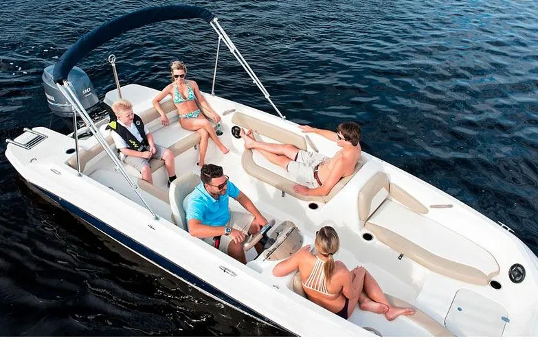 Slide: The Image of Manufacturer Provided Image: 2020 Stingray 182 SC boat with people enjoying a sunny day on the water. - 14