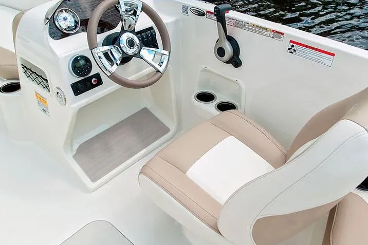 Slide: The Image of Manufacturer Provided Image: 2020 Stingray 182 SC boat interior with steering wheel and captain's chair. - 16