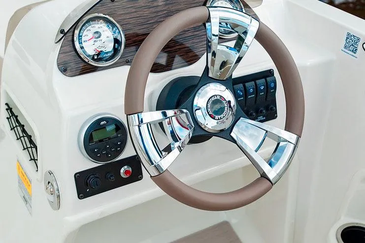Slide: The Image of Manufacturer Provided Image: 2020 Stingray 182 SC boat dashboard with steering wheel and control panel. - 17
