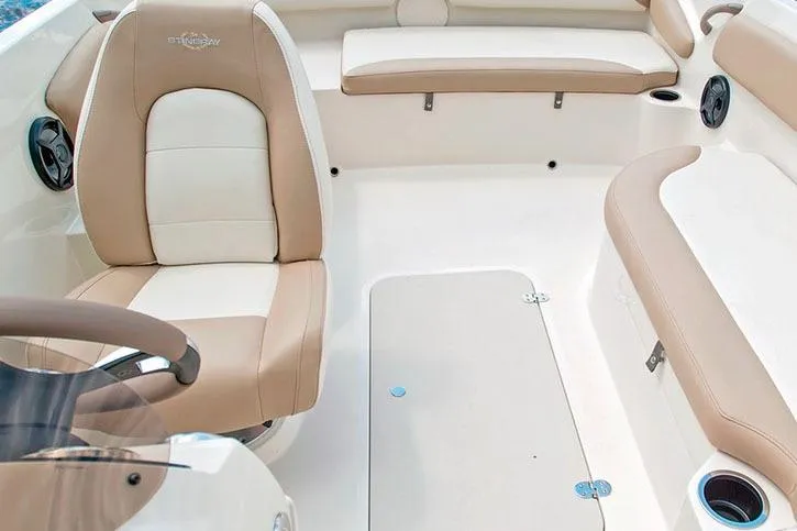 Slide: The Image of Manufacturer Provided Image: 2020 Stingray 182 SC boat interior with beige and white seating. - 18