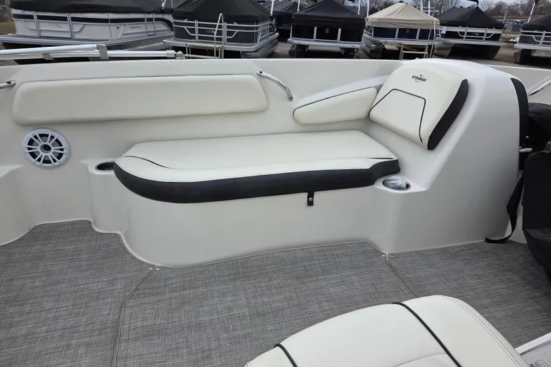 Slide: The Image of 2020 Stingray 182 SC boat interior with white seating and speaker. - 5