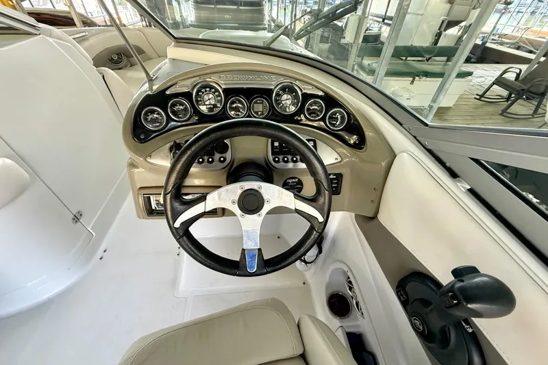 Slide: The Image of 2008 Crownline 260 LS boat dashboard with steering wheel and instrument panel. - 24
