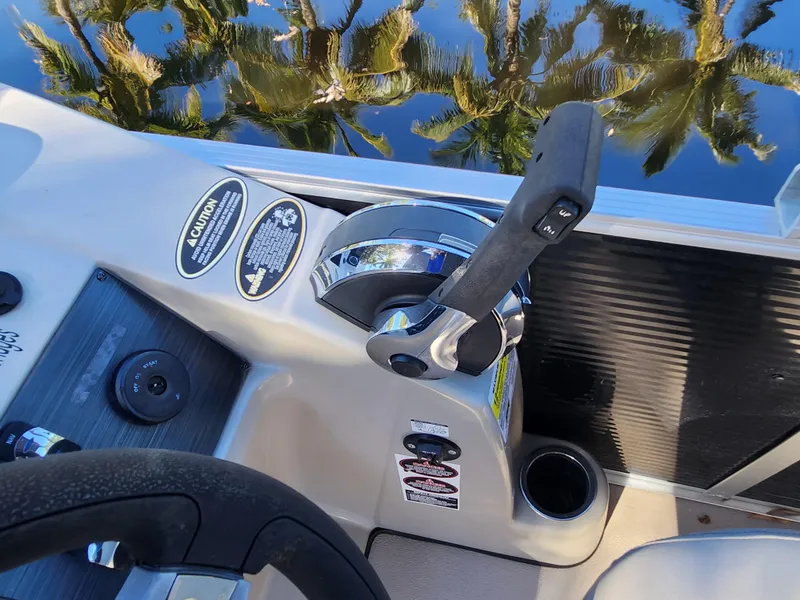 Slide: The Image of 2020 Cypress Cay Seabreeze 232 boat interior with plush seating and cup holder. - 16