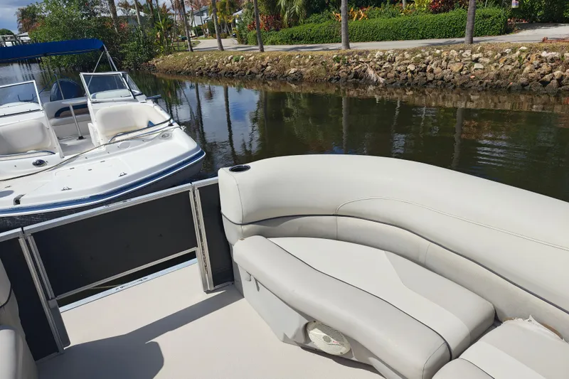 Slide: The Image of 2020 Cypress Cay Seabreeze 232 pontoon boat interior with canal view. - 21