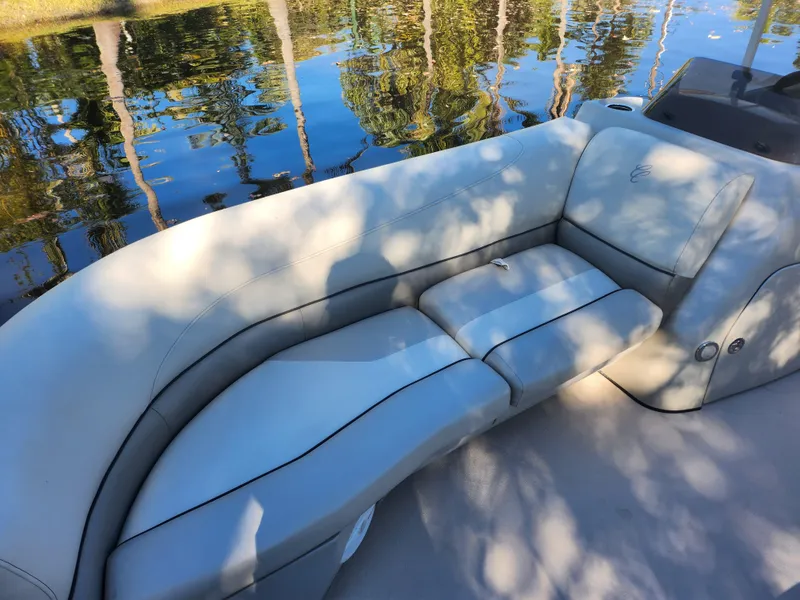 Slide: The Image of Steering console of 2020 Cypress Cay Seabreeze 232 pontoon boat, featuring gauges and controls. - 9