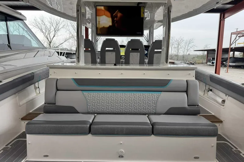 Slide: The Image of 2026 Regal 38 Surf boat interior with modern seating and entertainment system. - 10