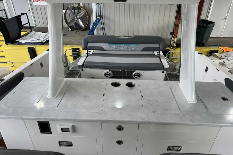 Slide: The Image of 2026 Regal 38 Surf boat interior with seating and storage compartments. - 12