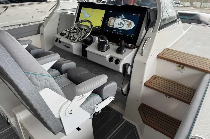 Slide: The Image of 2026 Regal 38 Surf boat cockpit with advanced navigation system and luxurious seating. - 16