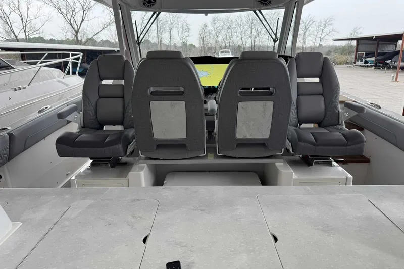 Slide: The Image of 2026 Regal 38 Surf boat interior with modern seating and navigation display. - 19