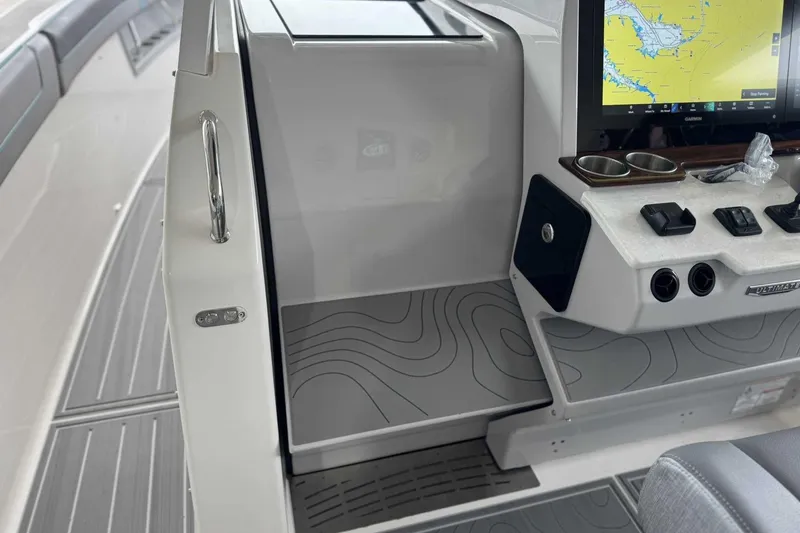 Slide: The Image of 2026 Regal 38 Surf boat interior with navigation screen and control panel. - 22