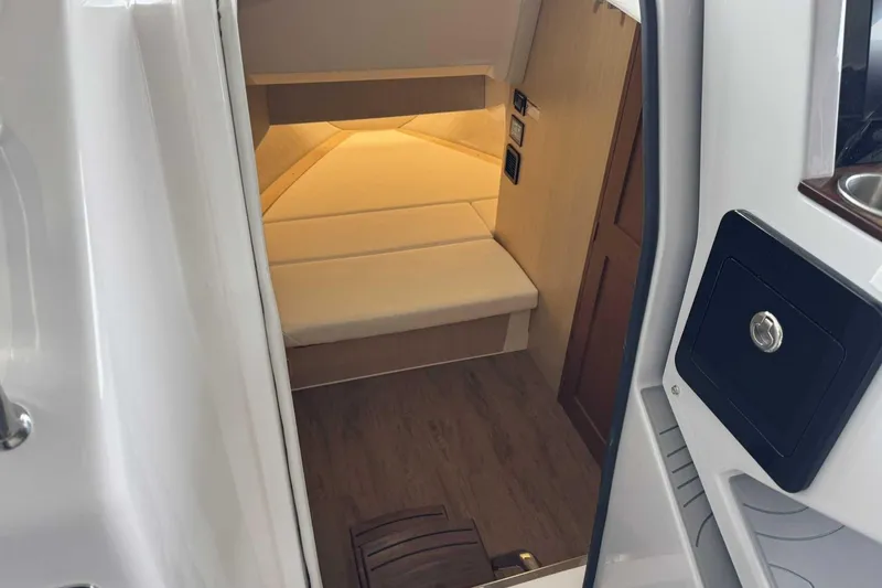 Slide: The Image of Interior cabin of 2026 Regal 38 Surf boat with cozy seating and modern design. - 27