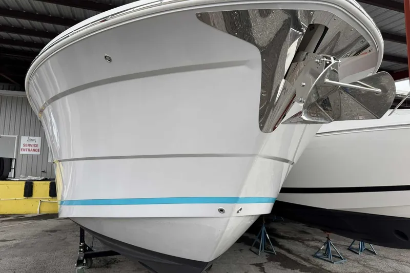 Slide: The Image of 2026 Regal 38 Surf boat in storage, showcasing sleek design and modern features. - 3