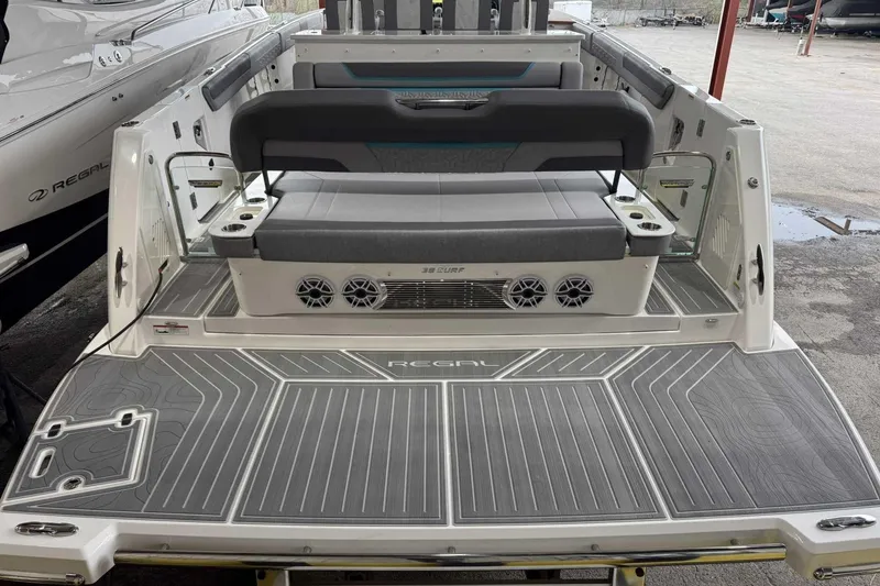 Slide: The Image of 2026 Regal 38 Surf boat with spacious deck and seating area. - 7
