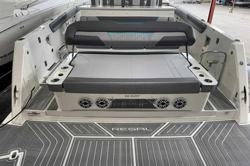 Slide: The Image of 2026 Regal 38 Surf boat interior with seating and cup holders. - 8