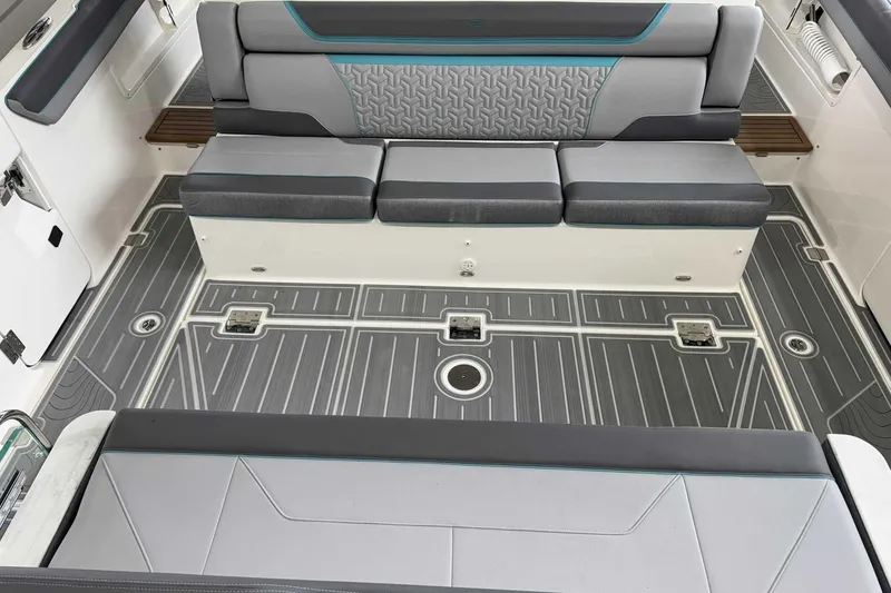 Slide: The Image of 2026 Regal 38 Surf boat interior with gray seating and patterned flooring. - 9