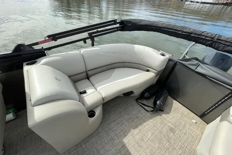 Slide: The Image of 2023 Cypress Cay Seabreeze 252 pontoon boat interior with plush seating and cup holders. - 7