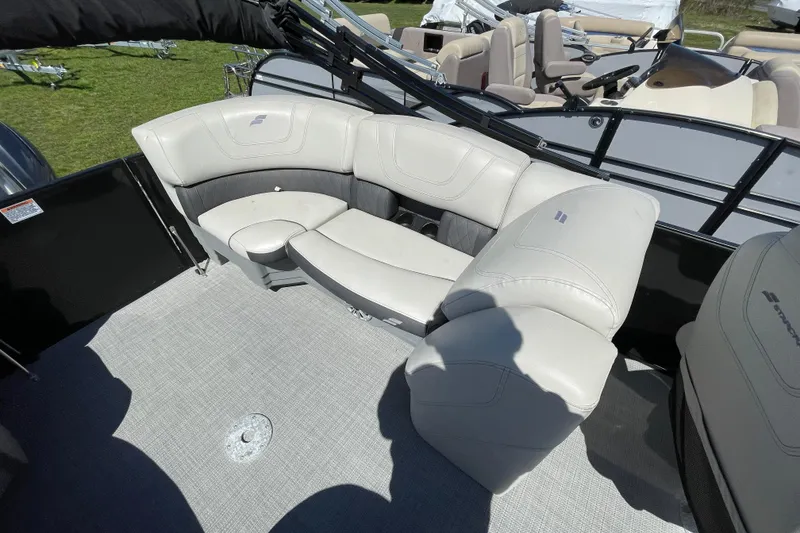 Slide: The Image of Luxurious seating on 2020 Starcraft SLS 3 pontoon boat, featuring plush white upholstery. - 12