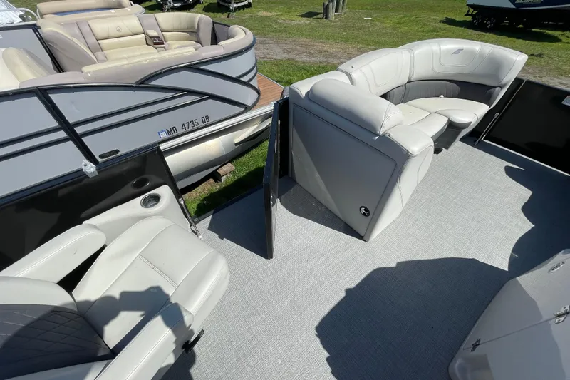 Slide: The Image of 2020 Starcraft SLS 3 pontoon boat interior with plush seating and modern design. - 7
