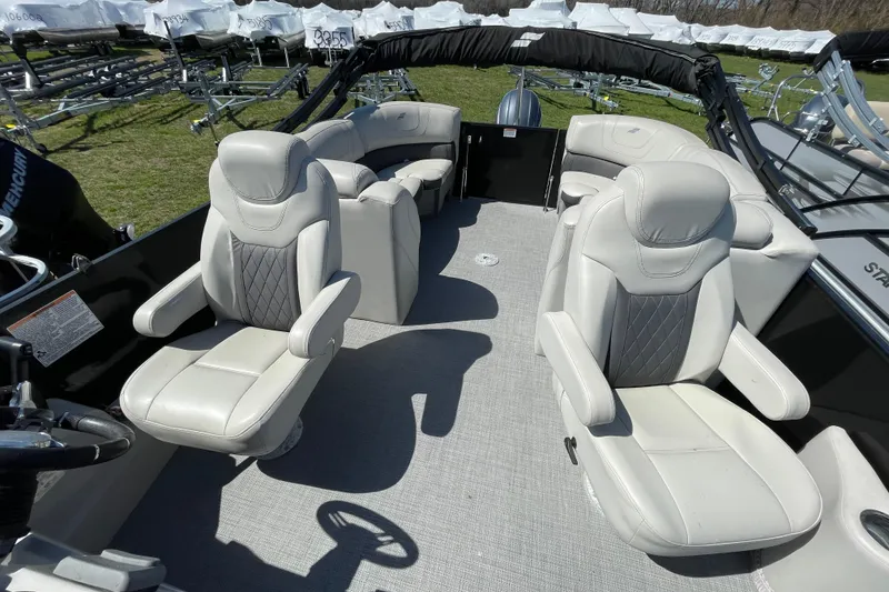 Slide: The Image of 2020 Starcraft SLS 3 boat interior with plush white seating and steering wheel. - 8