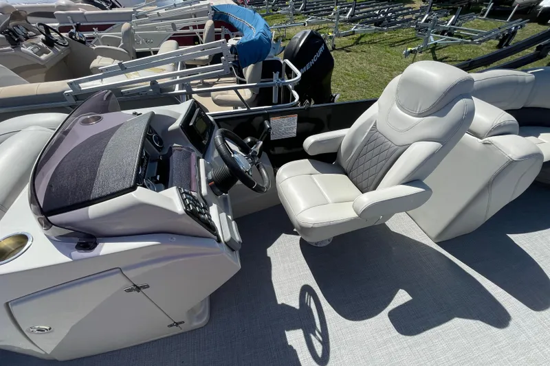 Slide: The Image of Captain's seat and helm of 2020 Starcraft SLS 3 boat, featuring modern controls and steering. - 9