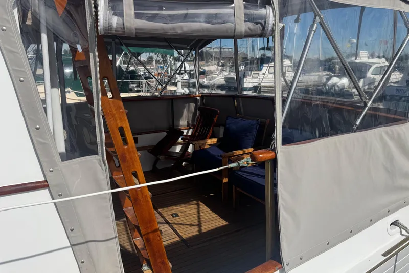 Slide: The Image of 1966 Grand Banks 32 Sedan boat interior with wooden ladder and seating area. - 13