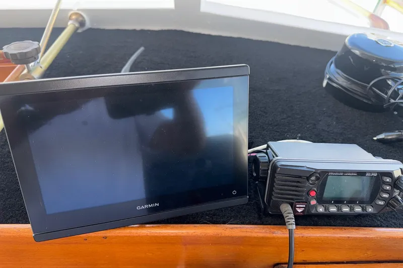 Slide: The Image of Garmin display and radio equipment on 1966 Grand Banks 32 Sedan boat dashboard. - 19