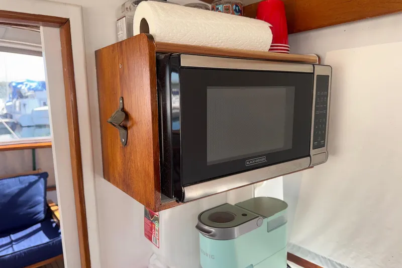 Slide: The Image of Microwave and coffee maker in 1966 Grand Banks 32 Sedan boat kitchen. - 22