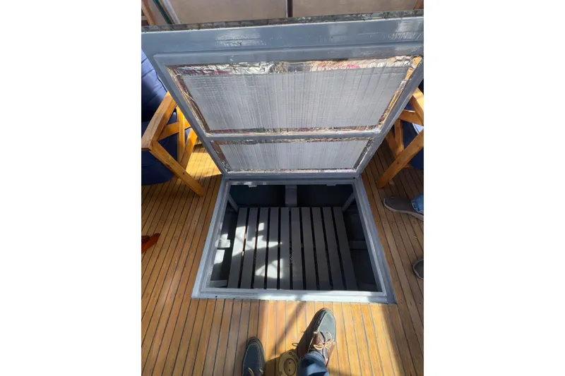 Slide: The Image of Open hatch on 1966 Grand Banks 32 Sedan boat with wooden deck. - 40