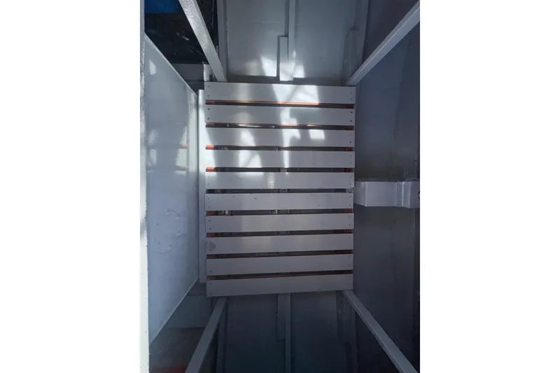 Slide: The Image of Interior view of a 1966 Grand Banks 32 Sedan boat with wooden slatted flooring. - 41