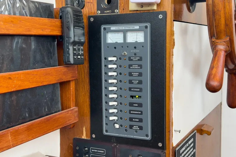 Slide: The Image of Electrical panel and radio on a 1966 Grand Banks 32 Sedan boat. - 55